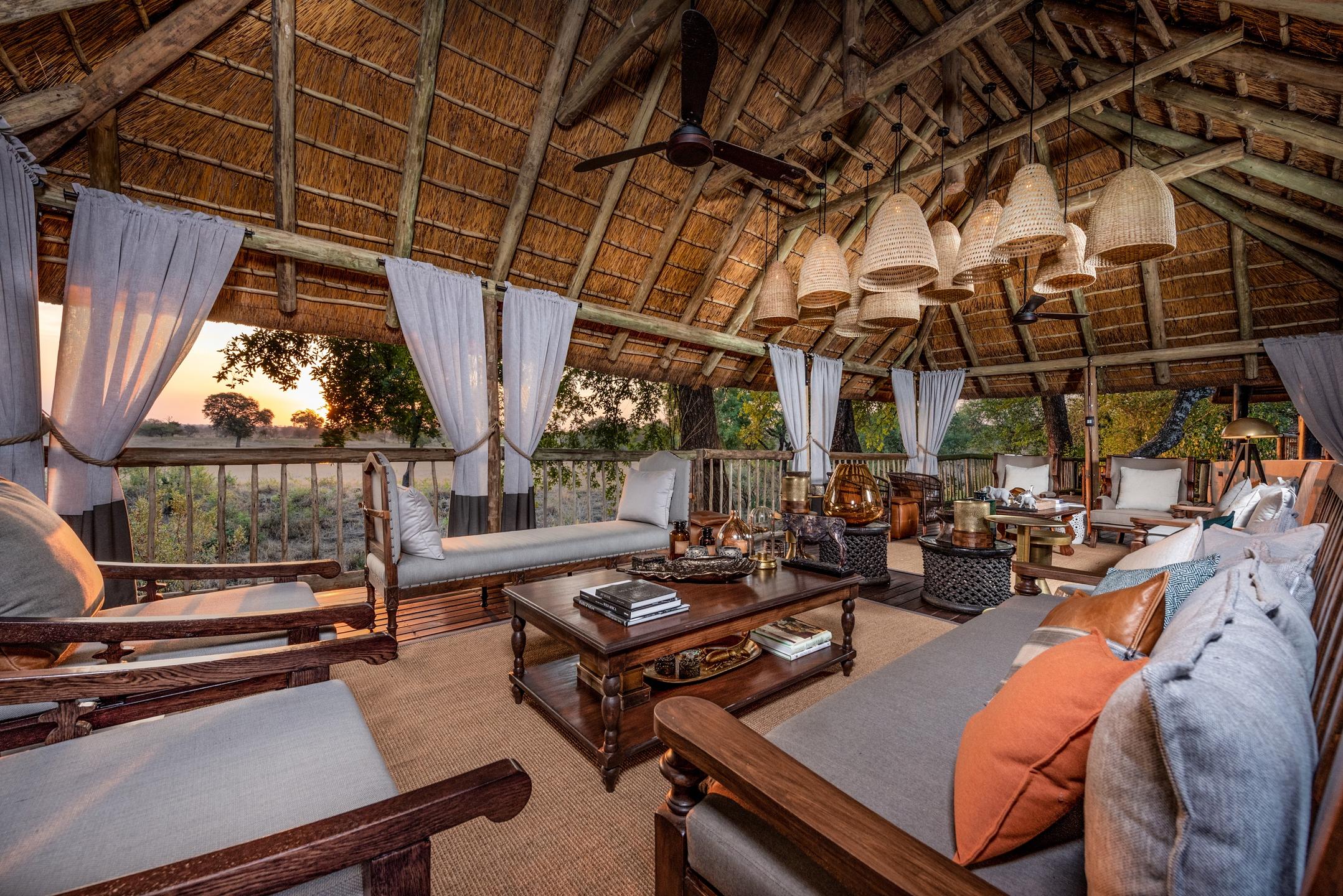 <p>The Selati Safari Lounge at Sabi Sabi is a cozy and inviting space to relax and unwind in between game drives. The lounge is designed to blend seamlessly into the environment with its thatched roof and rustic decor, creating an intimate and authentic African experience.</p>